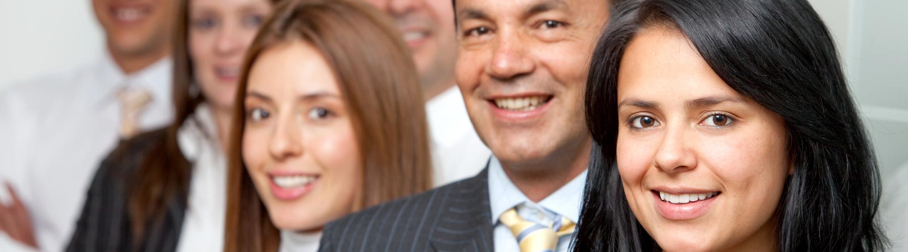 group of business people smiling into the camera